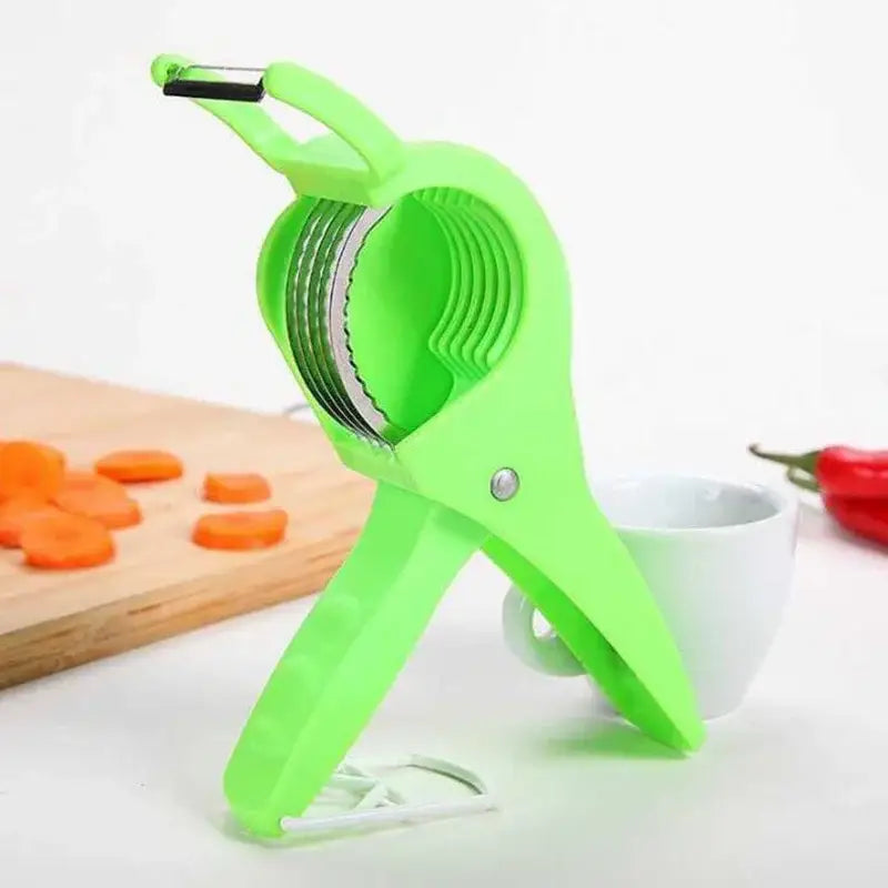 Bright green plastic 2-in-1 peeler slicer with stainless steel blades and ergonomic handle for kitchen use