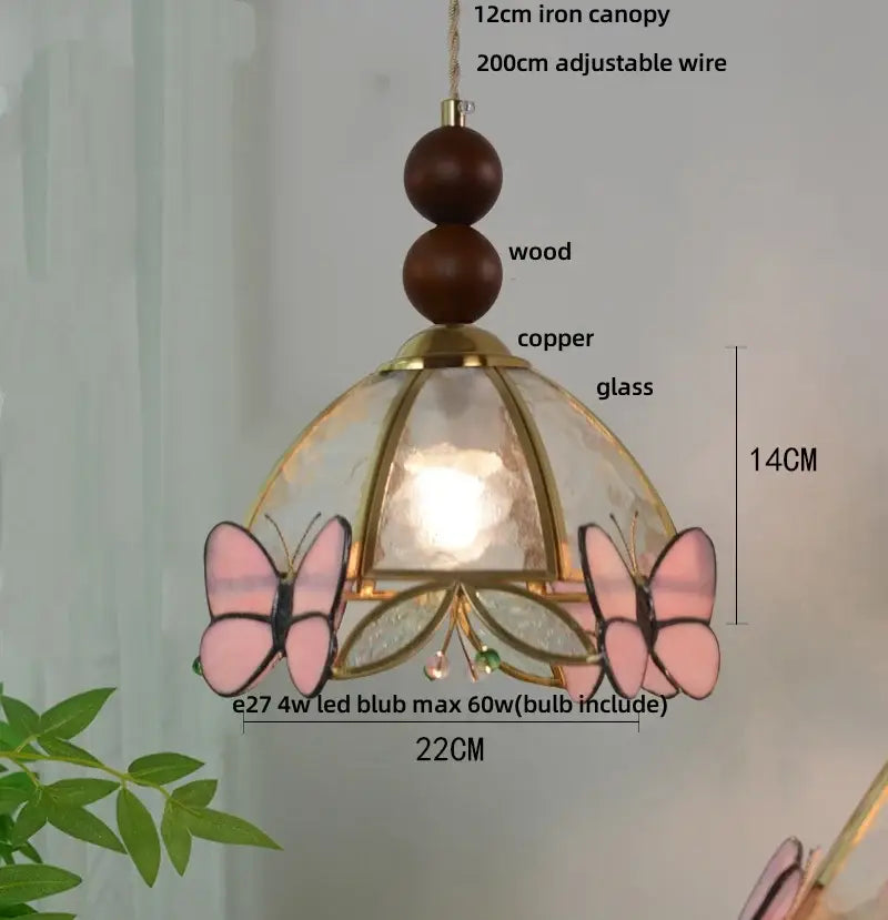 Delicate pink butterfly pendant light with copper frame and wooden canopy featuring decorbites clear glass led accents