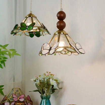 Two ornate stained glass pendant lights with green and white butterfly motifs and brass accents for bedroom decorbites clear glass