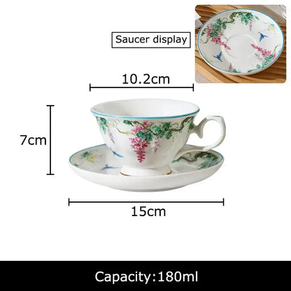 A delicate white porcelain cup with green vine flower design and turquoise rim from decorbites green vine tea set
