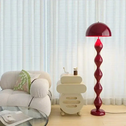 A deep red glossy floor lamp with a twisted stem and dome shade for decorbites circle mushroom floor lighting