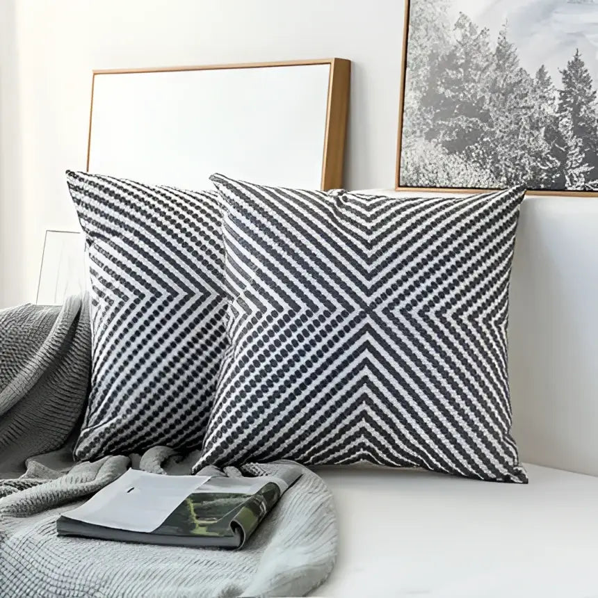 Two gray and white chevron patterned cushion covers with grey geometric embroidered design for living room decorbites