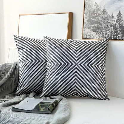 Two gray and white chevron patterned cushion covers with grey geometric embroidered design for living room decorbites