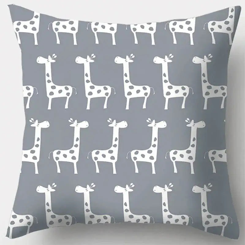 Gray throw pillow case with grey geometry pattern featuring white stylized giraffes with black spots for living room decor