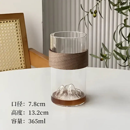 Clear glass guanshan hanging ear coffee cup with ribbed top, wood band, and etched mountain base by decorbites