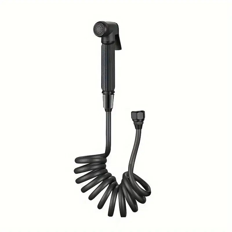 Black coiled handheld shower nozzle with textured grip and threaded connection in gunmetal gray copper bidet parts set