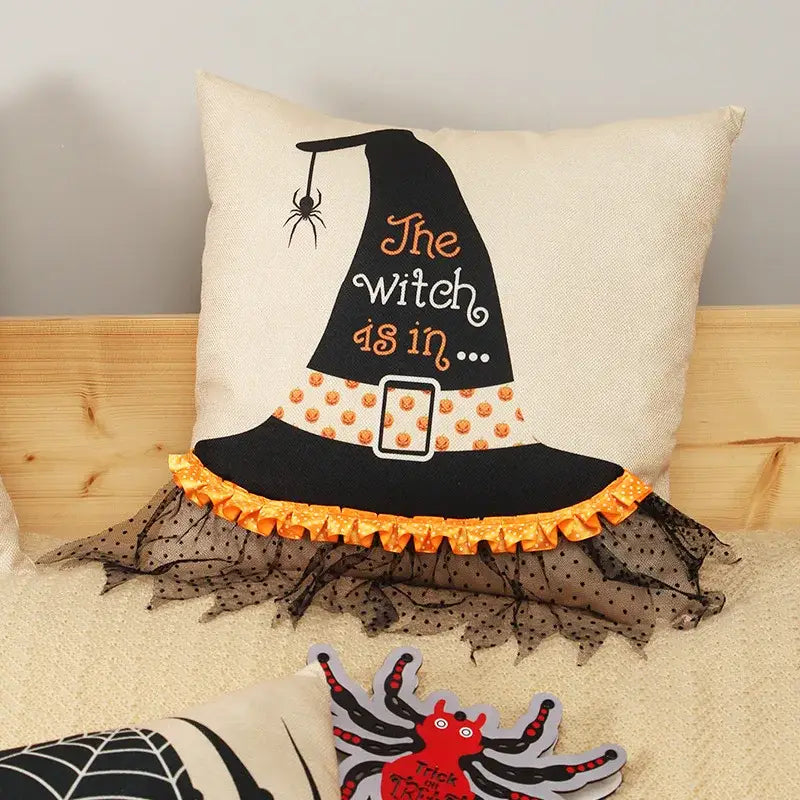 Cream-colored halloween wizard hat pillow cover with spider embroidered black witch hat orange belt and sheer mesh hem