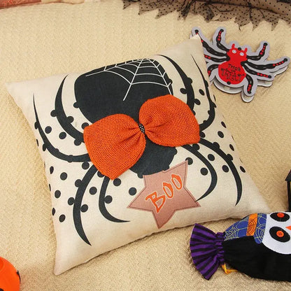 Cream-colored halloween wizard hat pillow cover with spider embroidered design and orange burlap bow for living room decor