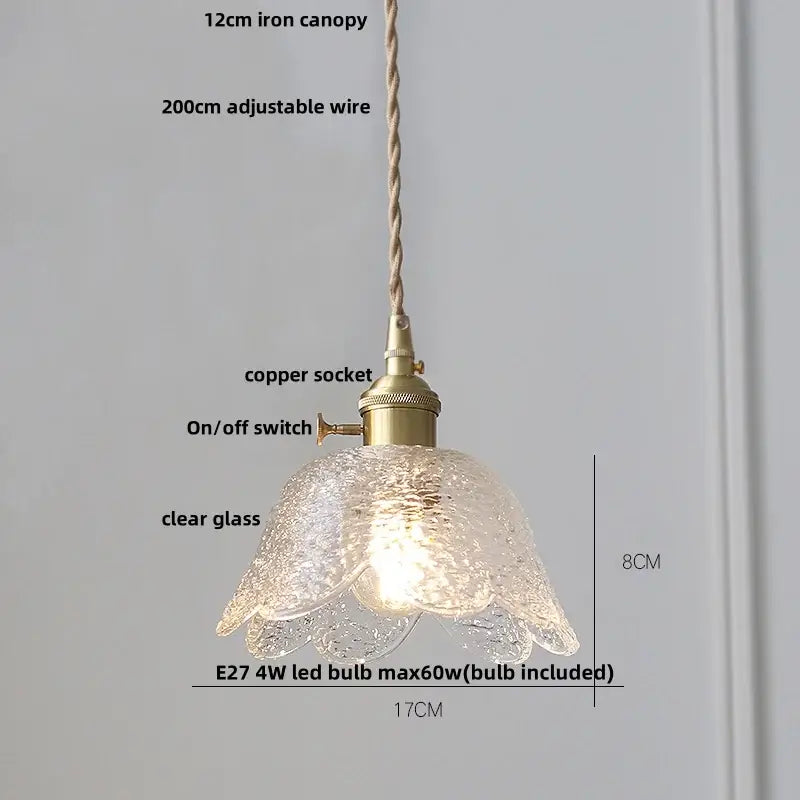 A delicate amber glass led pendant light with textured petals and brass fittings for kitchen use