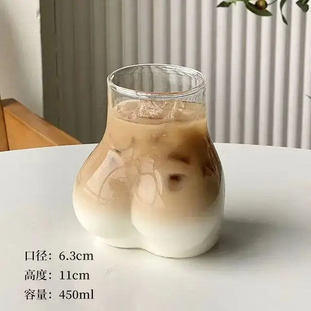 Hammered clear glass cafe coffee cup shaped like buttocks filled with iced coffee from decorbites glass cafe