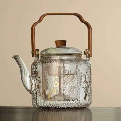 Clear glass teapot with hammered texture white floral green vine gold foil decals and bronze wooden handle decorbites glass teapot