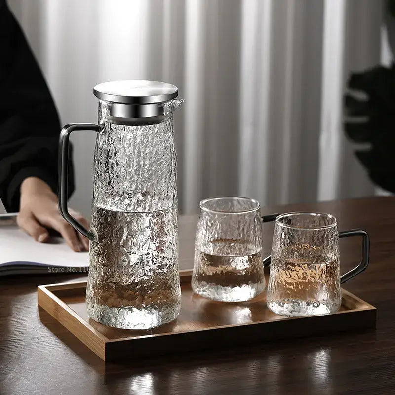 Clear textured glass gray amber water pitcher with stainless steel lid and handle with two matching decorbites tumblers