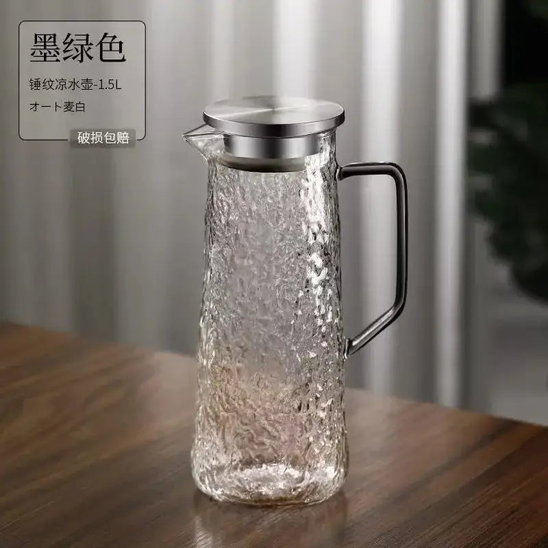 A textured ink green glass water pitcher with metallic lid and handle from decorbites gray amber collection for dining