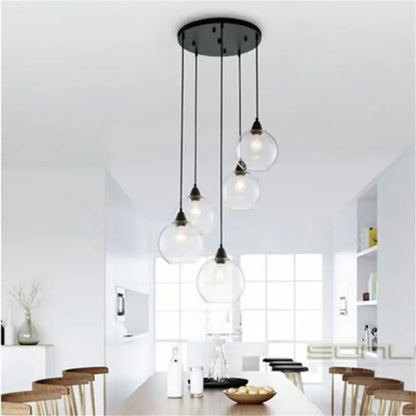 Modern black metal pendant light with hand blown clear glass globe lampshades for living room lighting