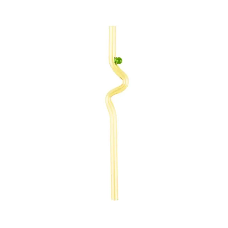 A translucent yellow hand blown glass straw with wavy design and green bead from decorbites glass straws set