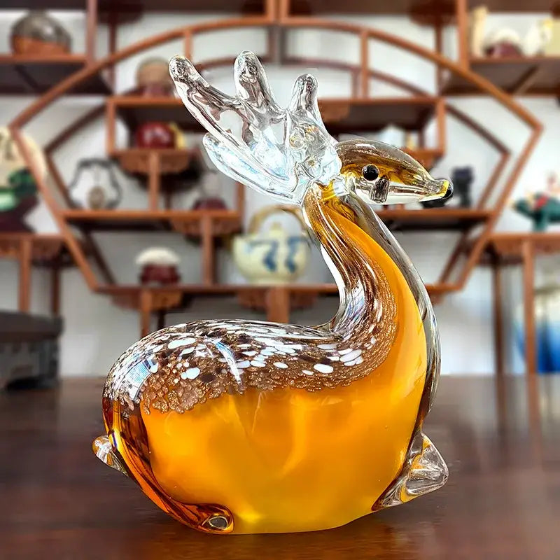 Translucent amber hand blown glass sika deer figurine with clear antlers and white speckled back for living room decor