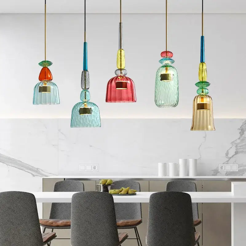 Hand blown textured colorful glass pendant lights with teal red and gold bell-shaped shades for kitchen accent