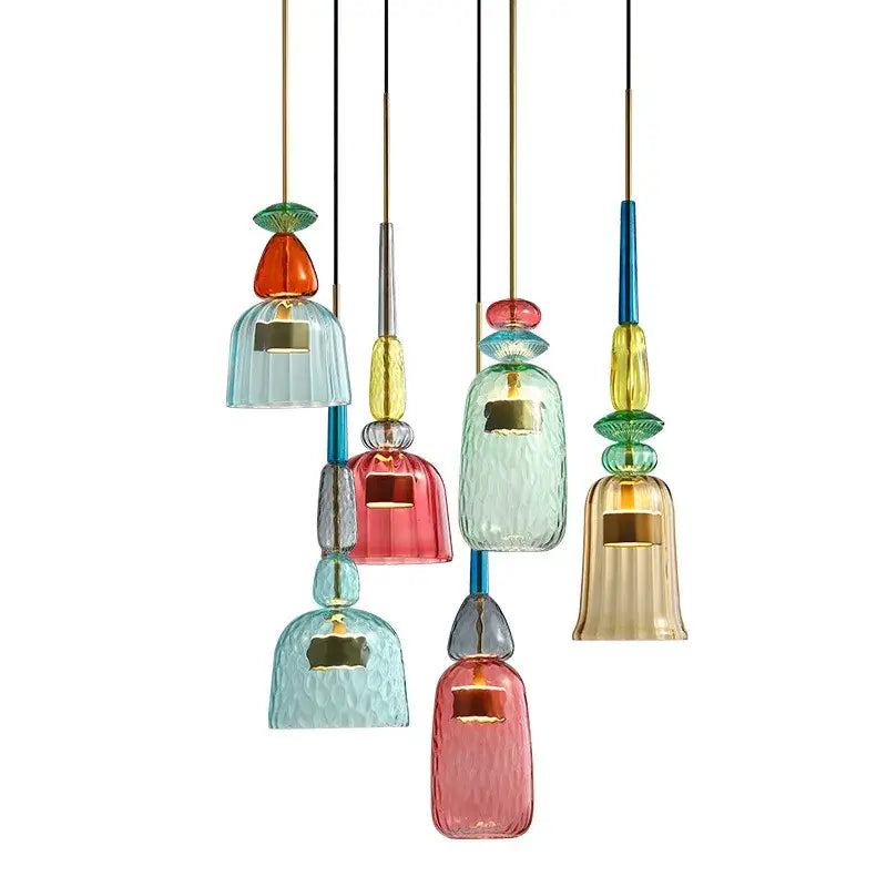 A collection of colorful hand blown textured glass pendant lights with gold accents for kitchen accent lighting