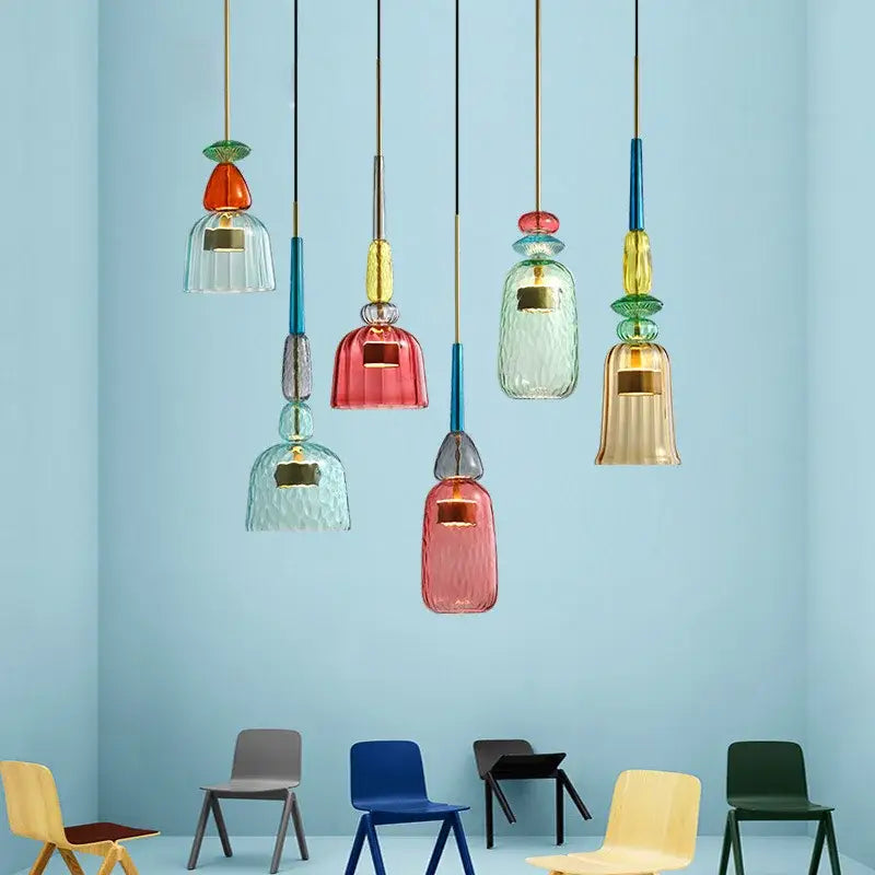 Hand blown textured colorful glass pendant lights with bell-shaped shades and metallic accents for kitchen accent