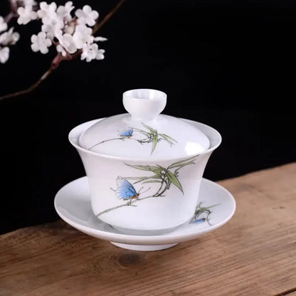 Hand painted bird and bamboo white porcelain gaiwan with decorbites blue butterfly and green leaf design with lid and saucer