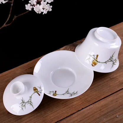 White porcelain gaiwan tea set featuring hand painted birds and bamboo on fine white porcelain for dining room decorbites blue