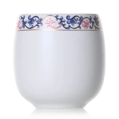 A white porcelain kung fu tea cup with hand-painted blue and pink floral border and gold trim from decorbites ceramic kung