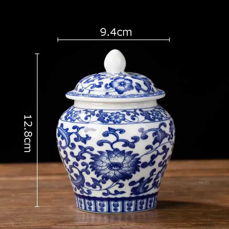 Hand-painted floral white porcelain tea canister with intricate blue patterns and matching lid for kitchen storage