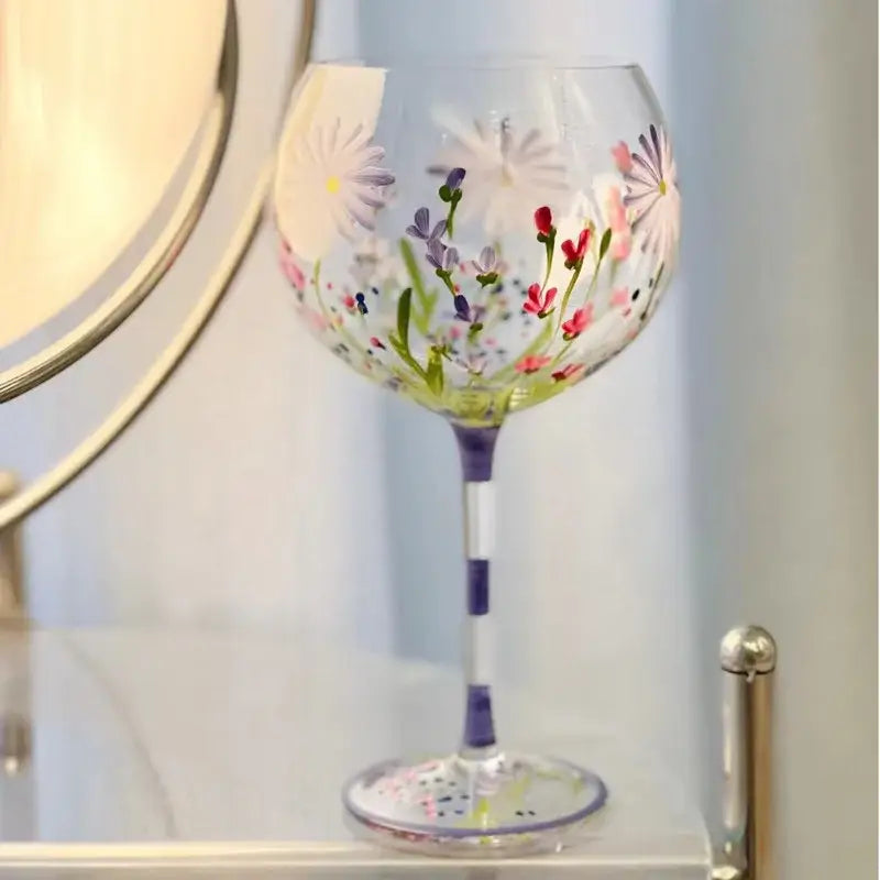Hand-painted floral wine goblet with soft pink purple white flowers on clear decorbites crystal glass with purple-striped stem