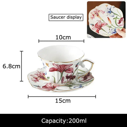A hand painted iris flower porcelain tea cup and saucer set with vibrant pink purple and blue floral decorbites iris flower design