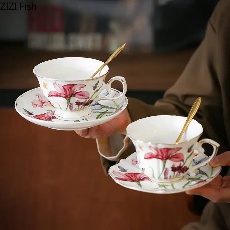 White porcelain iris flower porcelain teacups and saucers with hand-painted pink lilies and gold spoons for dining tableware