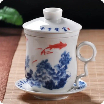Hand painted lotus white porcelain tea cup with lid and saucer featuring red koi fish and blue floral patterns for dining room