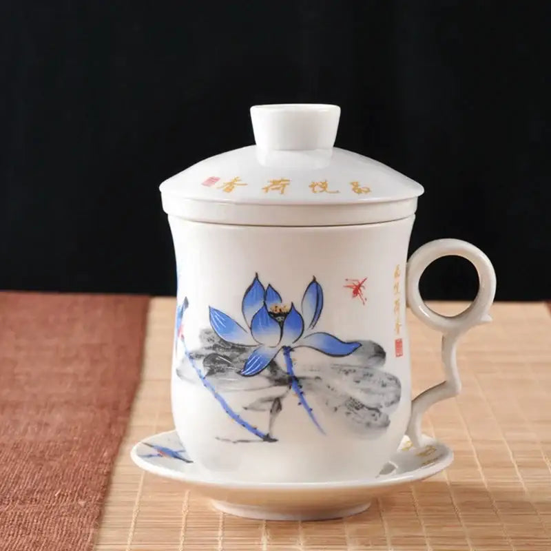 Hand painted lotus white porcelain tea cup with filter featuring blue lotus flowers and gold calligraphy on lid and saucer