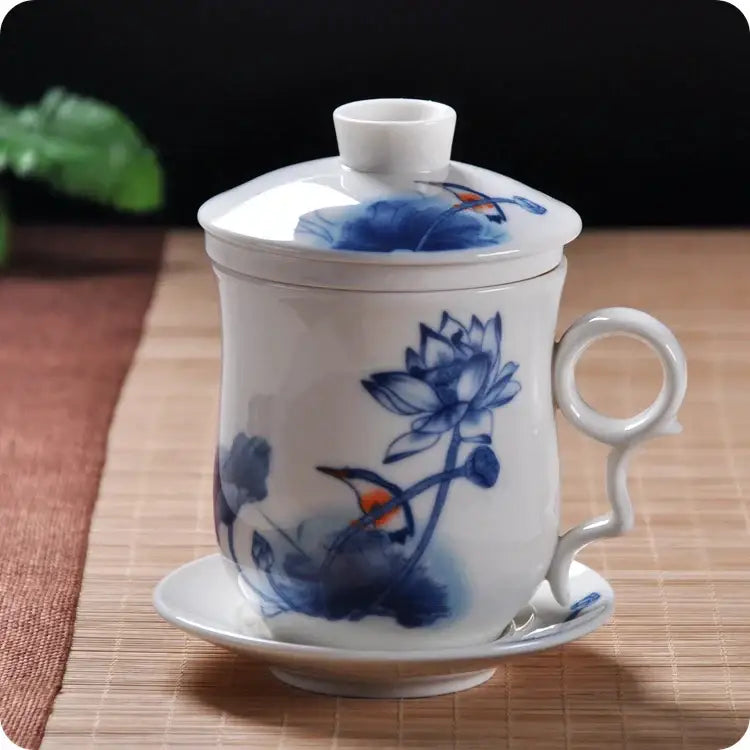 Hand painted lotus white porcelain tea cup with lid and saucer featuring blue floral patterns and birds for dining room use