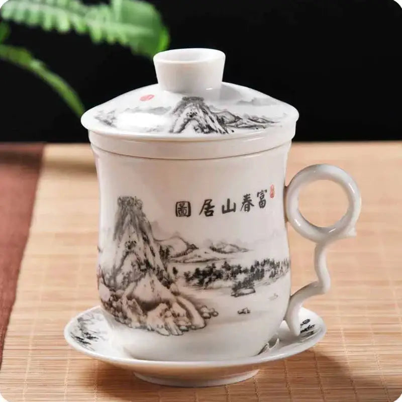 Hand painted lotus white porcelain tea cup with filter and matching lid features intricate black ink landscape design