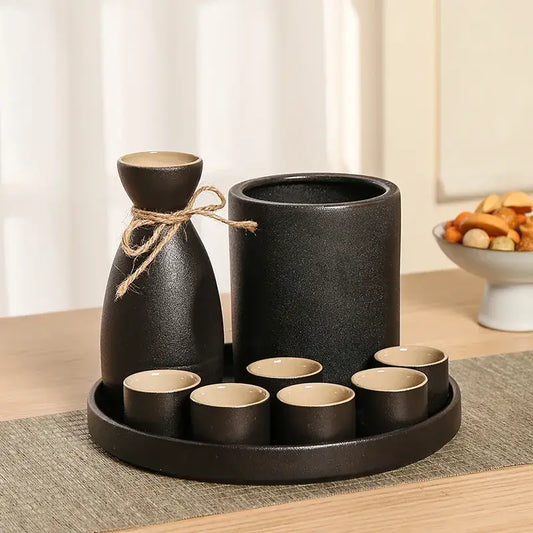 Handcrafted black ceramic wine warmer sake set with textured finish bottle tied with twine and six cups on tray decorbites black ceramic