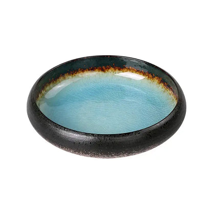 Handcrafted ceramic sushi plate with glossy turquoise crackle glaze interior and black rim with brownish-gold band