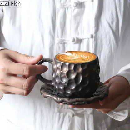 Dark gray hammered ceramic mug with matching saucer featuring textured surface in handcrafted hammer pattern ceramic mug set