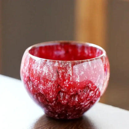 Vibrant red handcrafted ceramic coffee cup with a textured crackle glaze finish for dining room drinkware