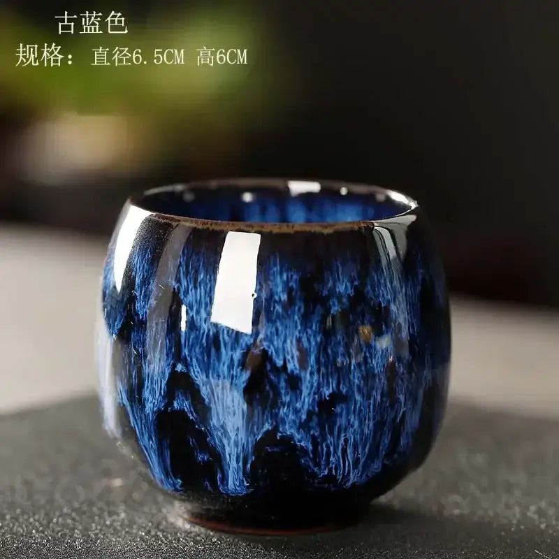 Glossy deep blue ceramic kung fu tea cup set with swirling textured crackle glaze and slightly flared rim for decorbites