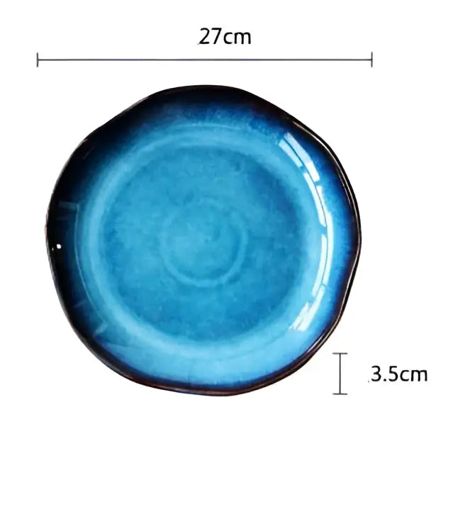 A handcrafted deep blue cobalt ceramic dessert plate with a glossy finish and textured rim from decorbites deep blue set