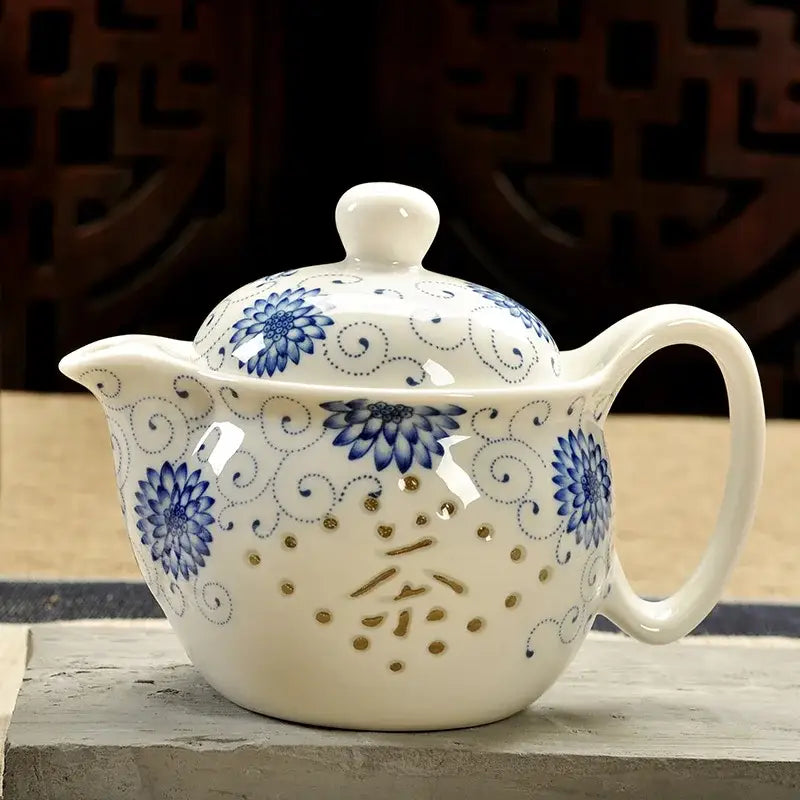 Handmade decorbites ceramic kung fu teapot in white with blue floral patterns and gold accents for dining room use