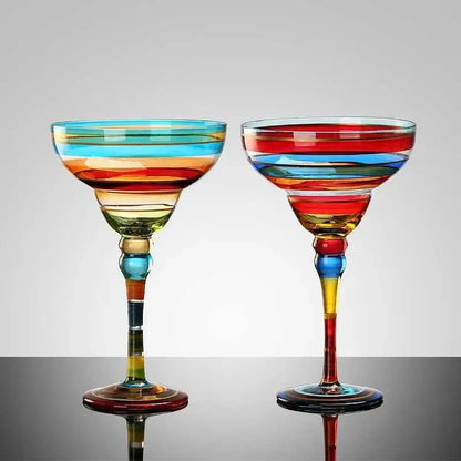 Two decorbites handmade colorful margarita glasses with vibrant red blue yellow and green horizontal stripes for dining room drinkware