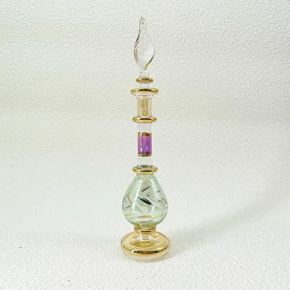Elegant handmade glass bottle with gold accents and purple inlay, an exquisite ornament for living room decor