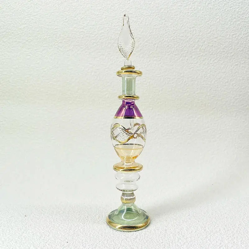 Handmade glass bottle with purple gold accents and leaf stopper as an exquisite ornament for living room decor