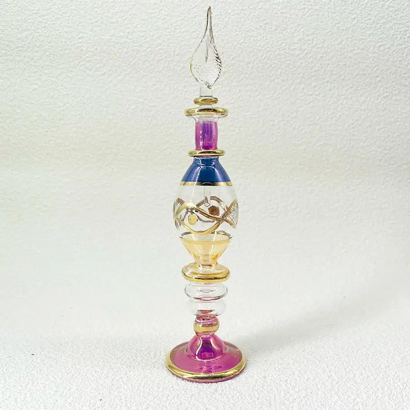 Handmade glass bottle with purple, blue, gold, and amber accents as an exquisite ornament for living room decor