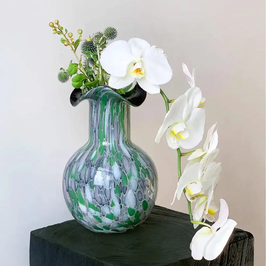 A decorbites handmade glass vase with emerald silver swirling pattern and elegant black flared rim for living room decor