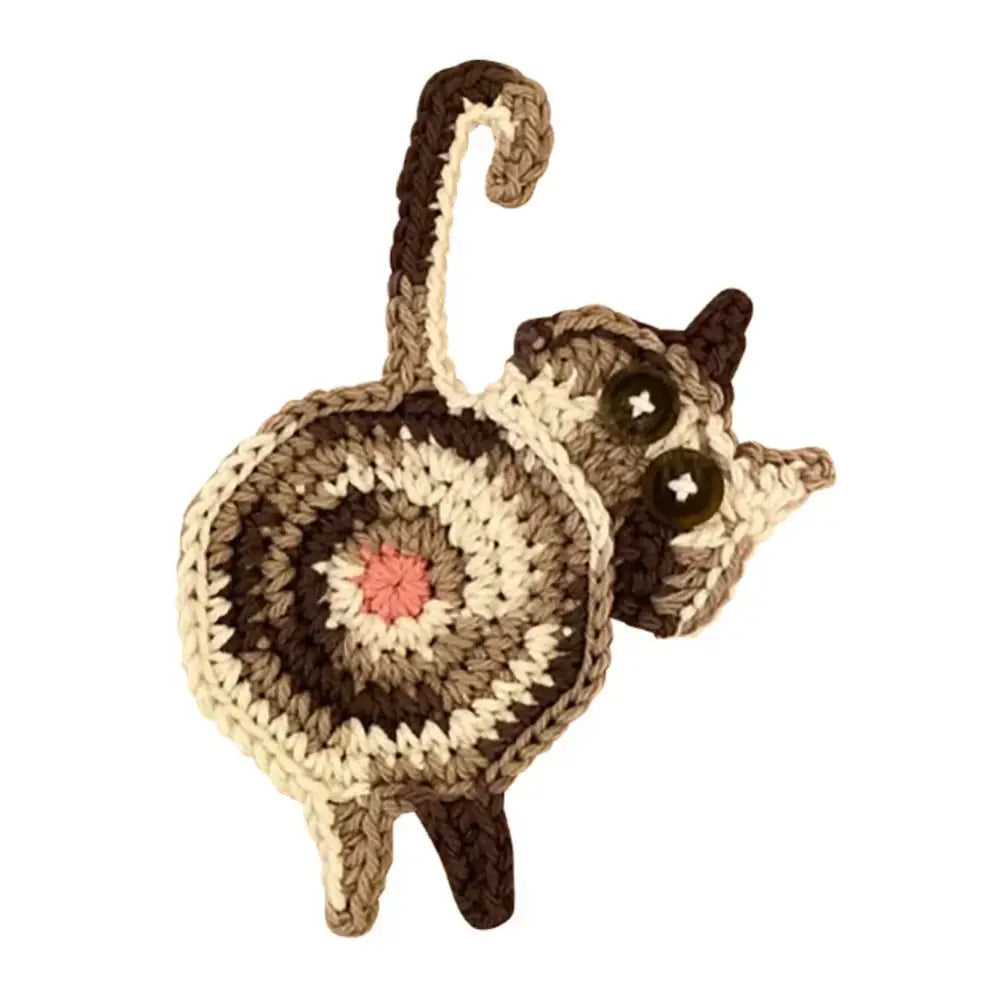 Handmade gray crocheted cat butt coasters from decorbites cat featuring brown cream yarn and button eyes set of 4