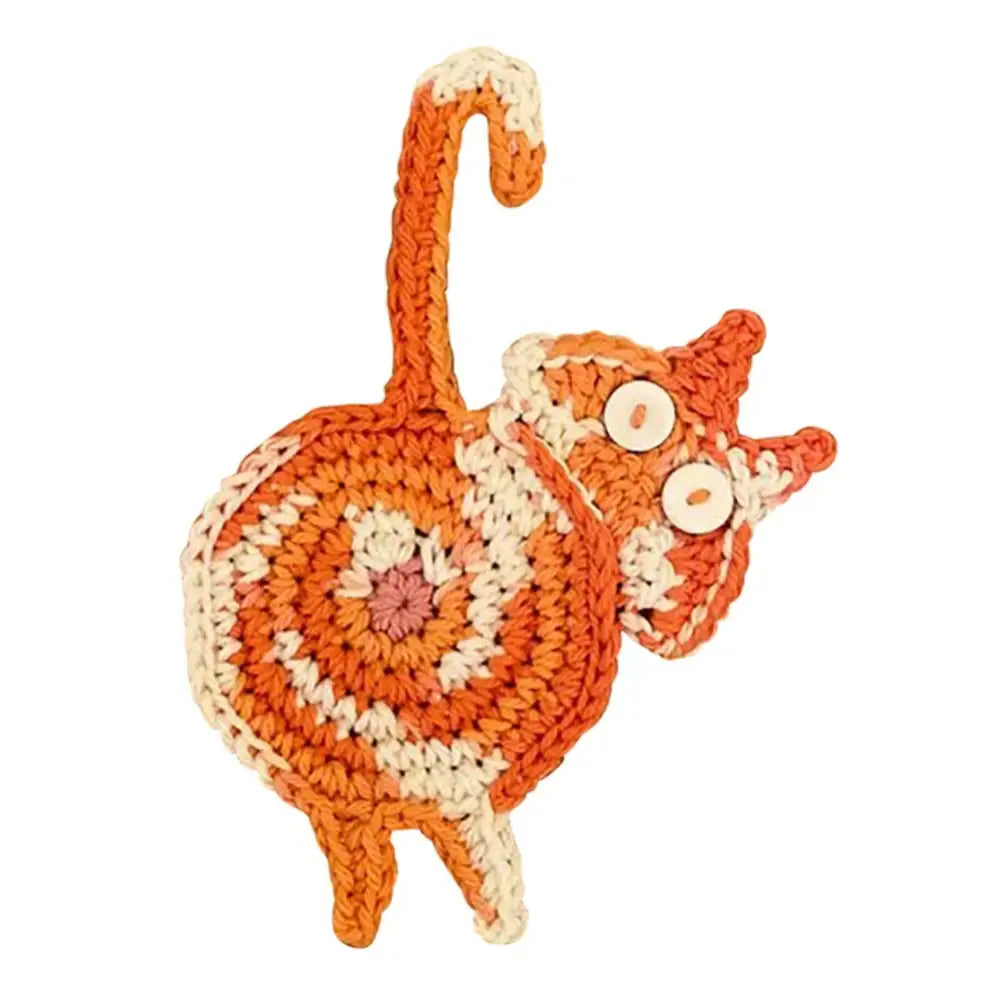 Orange and cream crocheted cat-shaped patch with button eyes for decorbites cat butt coasters dining room decor set of 4