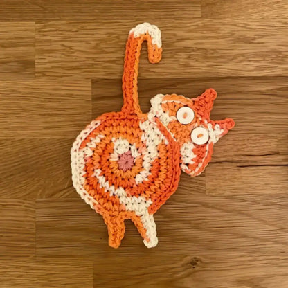 Handmade gray crocheted decorbites cat butt coasters set of 4 featuring an orange and white cat shape with button eyes