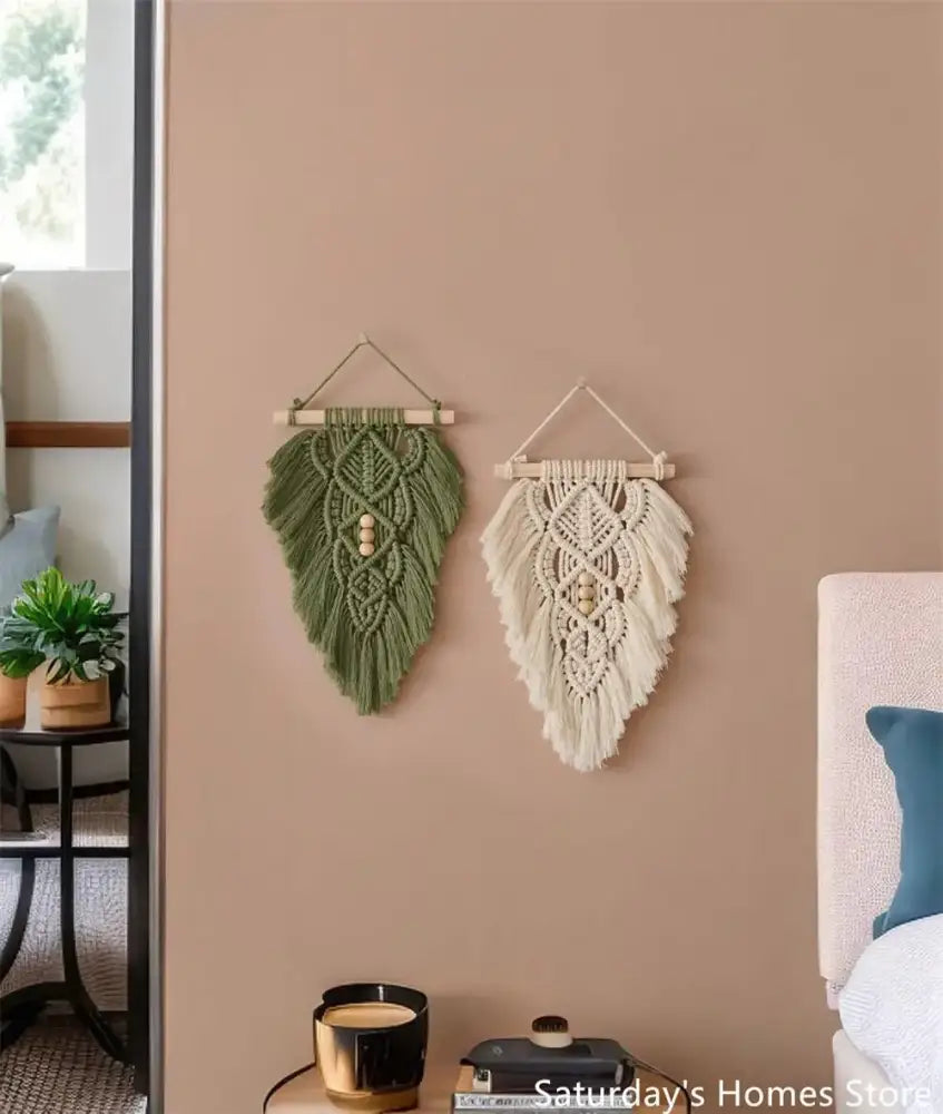 Handmade macrame leaf wall hanging set in olive green and off-white with wooden dowel and bead accents for bedroom decor